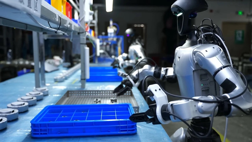 Humanoid robots working at a production line